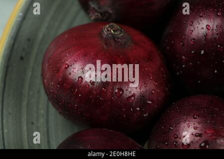 sweet red onions on background Stock Photo