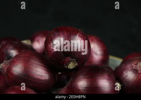 sweet red onions on background Stock Photo