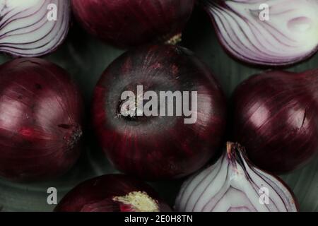 sweet red onions on background Stock Photo