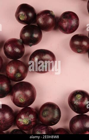 sweet red onions on background Stock Photo