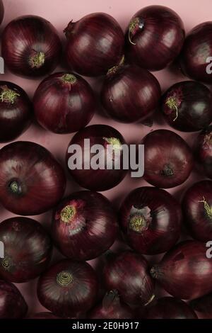 sweet red onions on background Stock Photo