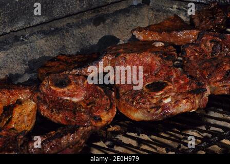 fresh meat grilled on charcoal grill in the garden and summer Stock Photo