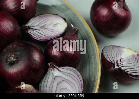 sweet red onions on background Stock Photo