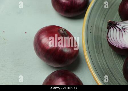 sweet red onions on background Stock Photo