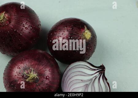 sweet red onions on background Stock Photo