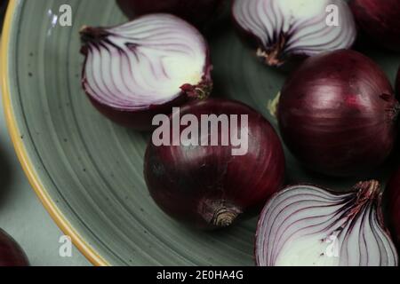 sweet red onions on background Stock Photo