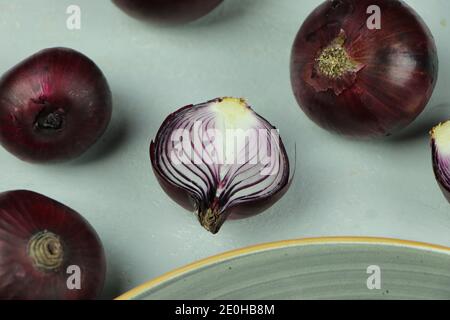 sweet red onions on background Stock Photo