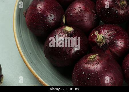sweet red onions on background Stock Photo