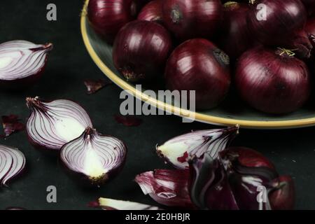 sweet red onions on background Stock Photo