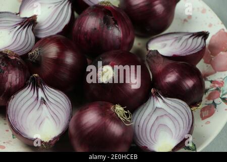 sweet red onions on background Stock Photo