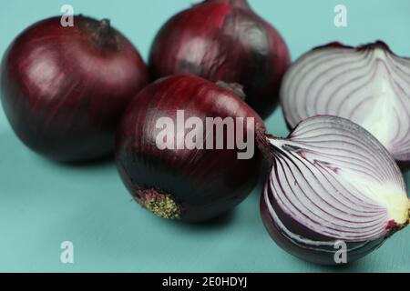 sweet red onions on background Stock Photo