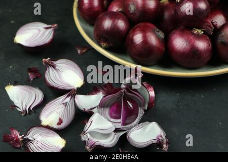 sweet red onions on background Stock Photo