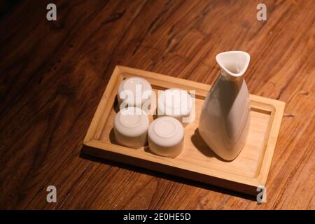 high angle view of traditional Japanese wine bottle and cups Stock Photo