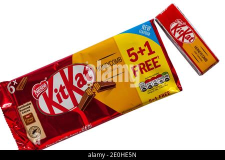 Packet of Nestle Honeycomb KitKat new flavour multipack with one removed set on white background - Kit Kat kitkats kit kats Stock Photo