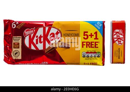 Packet of Nestle Honeycomb KitKat new flavour multipack with one removed isolated on white background - Kit Kat kitkats kit kats Stock Photo