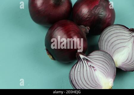 sweet red onions on background Stock Photo