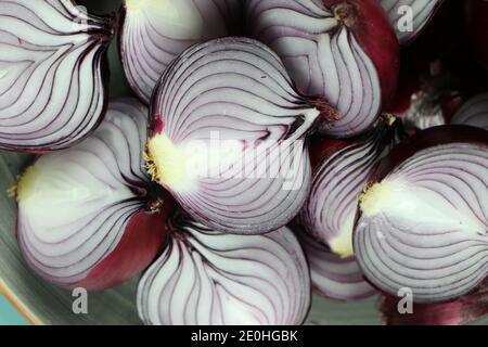 sweet red onions on background Stock Photo