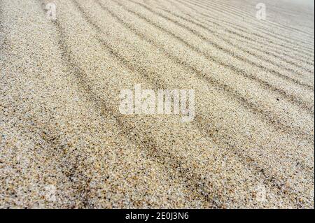 sand ripples, wavy sand surface, sandy smooth sea shore Stock Photo