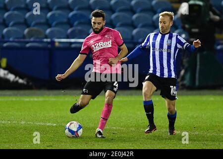 SHEFFIELD, ENGLAND. JAN 1ST Barry Bannan of Sheffield Wednesday closes on GraemeÊShinnie of Derby County during the Sky Bet Championship match between Sheffield Wednesday and Derby County at Hillsborough, Sheffield on Friday 1st January 2021. (Credit: Jon Hobley | MI News) Credit: MI News & Sport /Alamy Live News Stock Photo