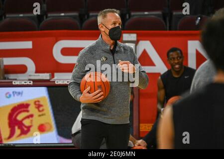 Colorado Buffaloes assistant coach Bill Grier assists players before an NCAA basketball game against the Southern California Trojans, Thursday, Dec. 3 Stock Photo