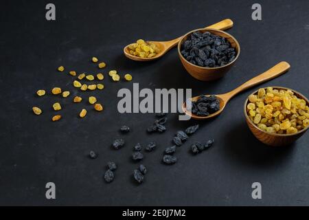 Dried raisins on black background Stock Photo