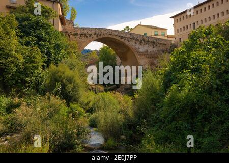 View of the medieval bridge of the Matarranya river from Beceite, Aragon, Spain Stock Photo