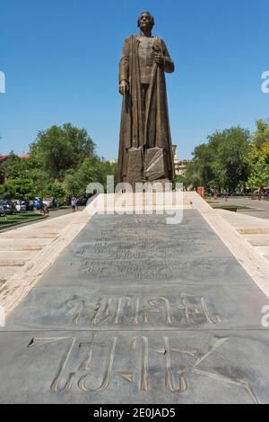 Statue of Garegin Nzhdeh (statesman and military strategist) with a pedestal made of travertine and basalt combination and the popular thoughts of Nzh Stock Photo