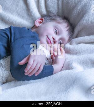 Child playing with teddy bear. Little boy hugging his favorite toy. Stock Photo