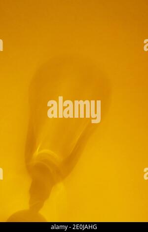 Abstract yellow background with blurred glass shadows. Smooth, soft focus. Copy space. Stock Photo