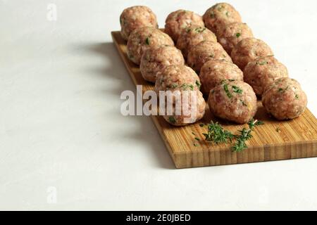 Fresh raw meat balls isolated on white background. Copy space. Stock Photo