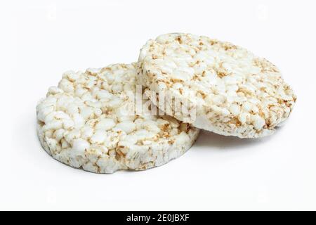 Two pieces of rice cake isolated on white. Dry dietary food Stock Photo