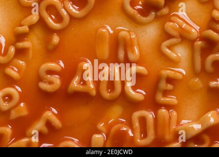 Message spelled out in pasta shapes Stock Photo