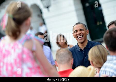 US President Barack Obama greets supporters after delivering remarks during the Independence Day picinic for White House staff and US service members held at the South Lawn of White House in Washington, DC, USA on July 04, 2012. Photo by Shawn Thew/Pool/ABACAPRESS.COM Stock Photo