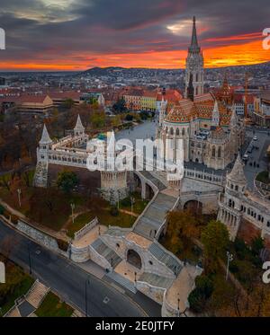 Budapest, Hungary - Aerial view of the famous Fisherman's Bastion (Halaszbastya) and Matthias Church on an autumn afternoon with dramatic golden sunse Stock Photo