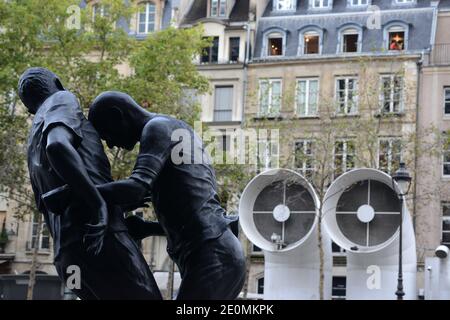 A bronze sculpture by Algerian artist Adel Abdessemed is on display in front of the Centre Pompidou contemporary art center, aka Beaubourg in Paris, France, September 26, 2012. The sculpture immortalizes the 'headbutt' given by the French former football champion Zinedine Zidane to Italian player Materazzi during the World Cup final in 2006. The Centre Pompidou will dedicate a retrospective to Abdessemed from October 3, 2012 to January 7, 2013. Photo by Mousse/ABACAPRESS.COM Stock Photo