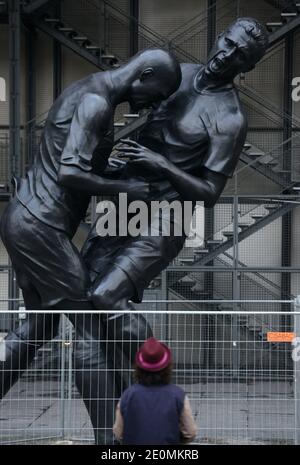 A bronze sculpture by Algerian artist Adel Abdessemed is on display in front of the Centre Pompidou contemporary art center, aka Beaubourg in Paris, France, September 26, 2012. The sculpture immortalizes the 'headbutt' given by the French former football champion Zinedine Zidane to Italian player Materazzi during the World Cup final in 2006. The Centre Pompidou will dedicate a retrospective to Abdessemed from October 3, 2012 to January 7, 2013. Photo by Mousse/ABACAPRESS.COM Stock Photo