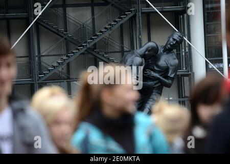 A bronze sculpture by Algerian artist Adel Abdessemed is on display in front of the Centre Pompidou contemporary art center, aka Beaubourg in Paris, France, September 26, 2012. The sculpture immortalizes the 'headbutt' given by the French former football champion Zinedine Zidane to Italian player Materazzi during the World Cup final in 2006. The Centre Pompidou will dedicate a retrospective to Abdessemed from October 3, 2012 to January 7, 2013. Photo by Mousse/ABACAPRESS.COM Stock Photo