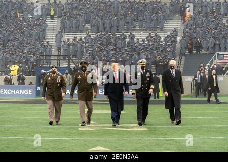 President Donald J. Trump, joined by acting Secretary of Defense Christopher C. Miller and the Chairman of the Joint Chiefs of Staff Gen. Mark A. Milley, walks across the football field to participate in the coin toss before the start of the 121st Army-Navy football game Saturday, Dec. 12, 2020, at Michie Stadium at the United States Military Academy at West Point, N.Y. People: President Donald Trump Credit: Storms Media Group/Alamy Live News Stock Photo