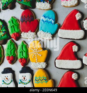 A variety of beautifully decorated Christmas sugar and gingerbread cookies on a baking sheet Stock Photo