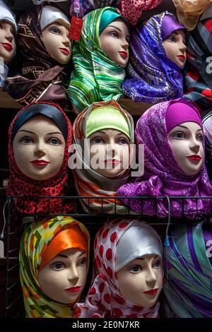 Mannequins dressed in colourful headscarves at a shop in the Fez medina in Morocco. The medina is the oldest walled part of Fez. Stock Photo