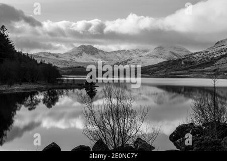 Looking down Llynnau Mymbyr lake from Capel Curig towards Snowdon. This lake is situated in the Snowdonia National Park in North Wales. Stock Photo