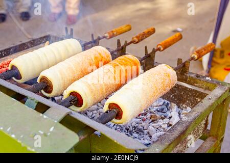 Baked Hungarian Pastry Chimney Cake Or Kurtos Kalacs Served On A White Standing Plate On Dark Concrete Background In Front Of A Black Brick Wall Clos Stock Photo Alamy