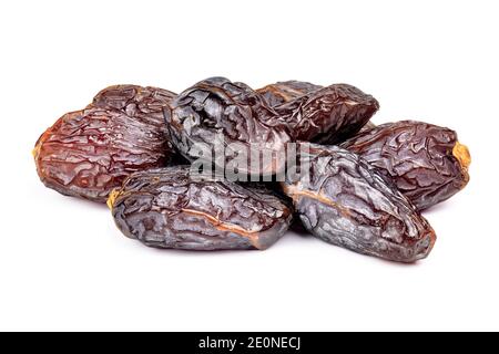 Amazing dates fruit isolated on white background. Pile of dried premium dates close-up. Stock Photo