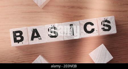 BASIC word on a wooden blocks on a light background. Stock Photo