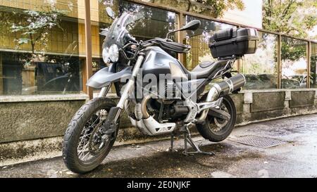 Rome,Italy - December 05, 2020: Beautiful motorcycle model Moto Guzzi V85 TT 850 in gray color parked in the street produced by Italian motorcycle man Stock Photo