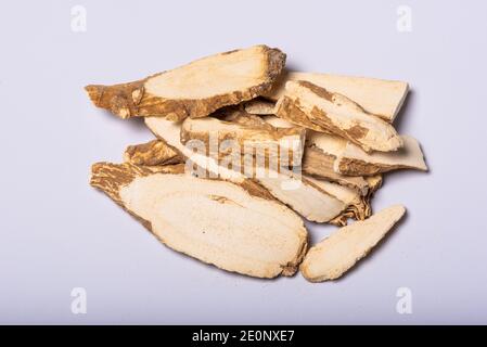 Dried angelica dahurica roots also known as chinese angelica heap close-up view on a white background Stock Photo
