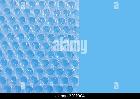 Bubble Wrap Packing Or Air Cushion Film on a blue background. Stock Photo