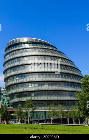 London, UK, July 30, 2009 : People walking by City Hall which is a  popular travel destination tourist attraction landmark stock photo image Stock Photo