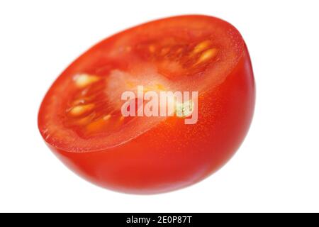 Single red cherry tomato half, isolated on white background Stock Photo