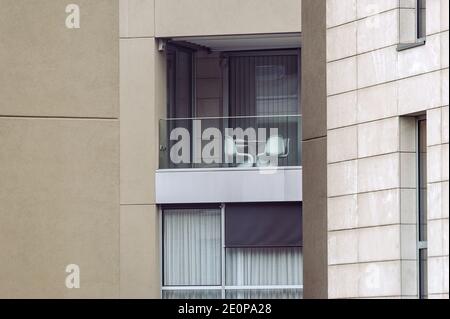 Milan - 12/31/2020: two chairs on a balcony of a modern building Stock Photo